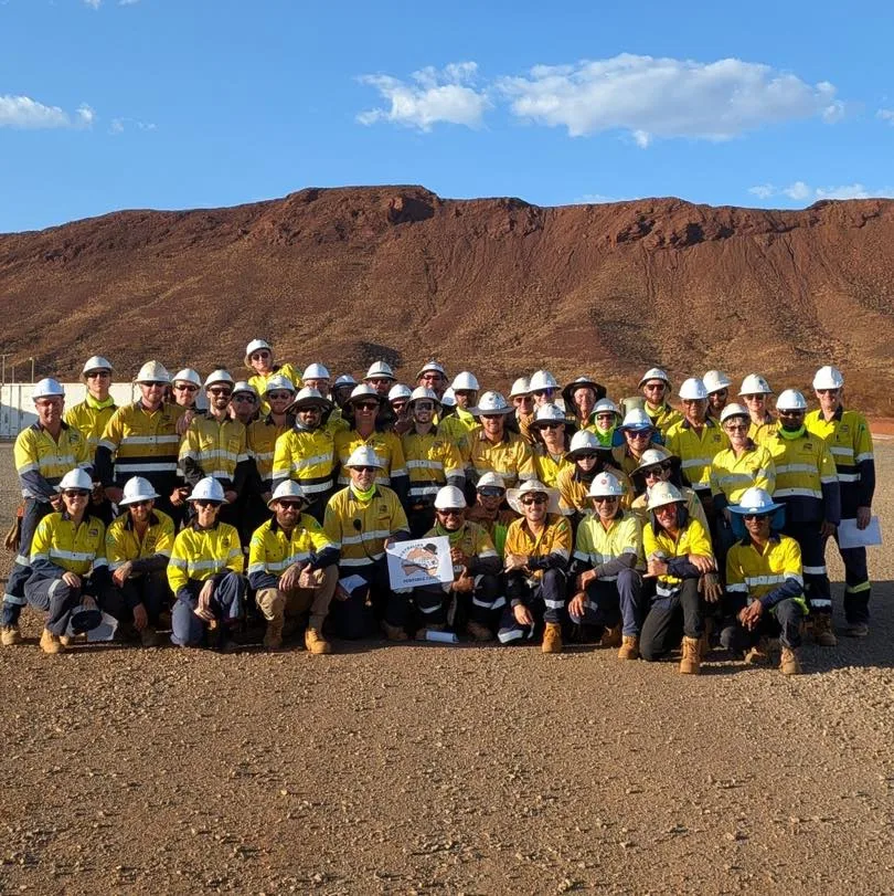 APC crew in high visibility workwear gathered together on a remote project site