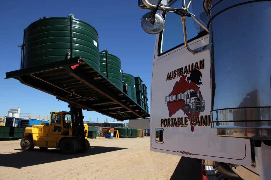A telehandler moving an APC accommodation module at the Monarto facility